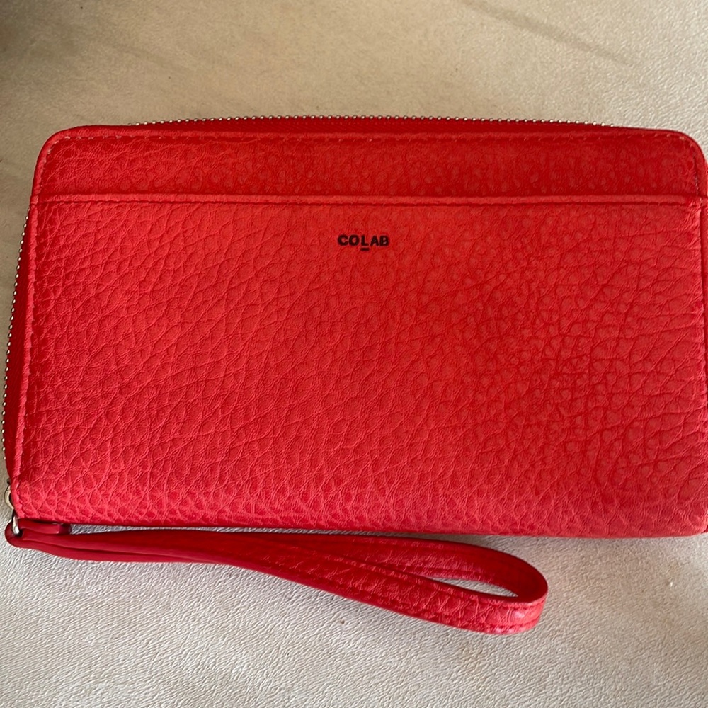 Brand new wallet without tags measures 5x8inches colour orange